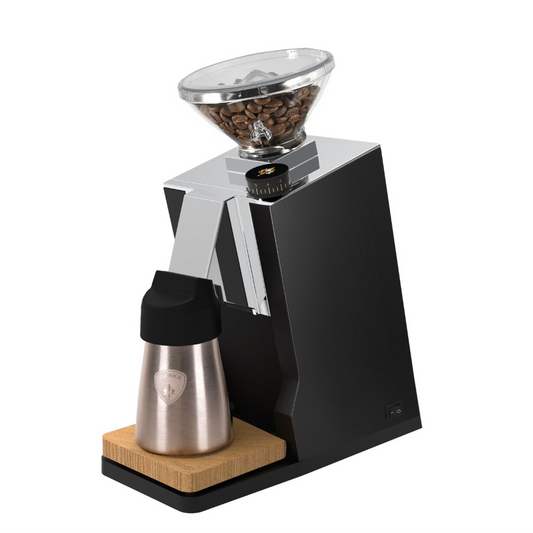 Coffee grinder with a container of coffee beans 